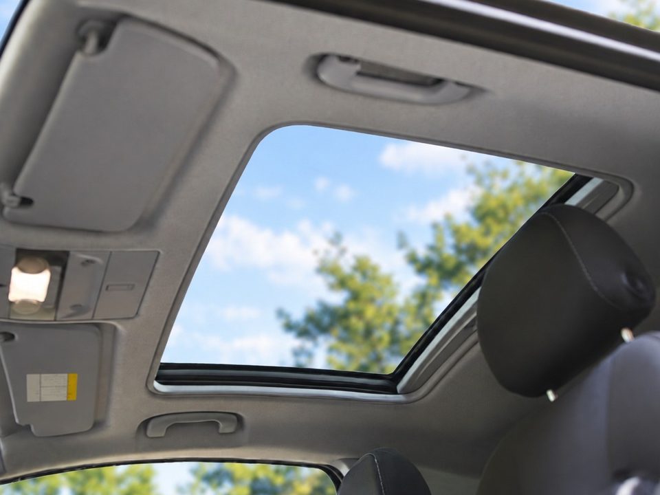 Open car sunroof seen from inside the cabin